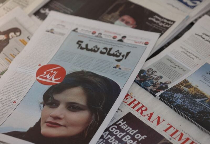 A newspaper with a cover picture of Mahsa Amini, a woman who died after being arrested by the Islamic republic's "morality police" is seen in Tehran, Iran September 18, 2022