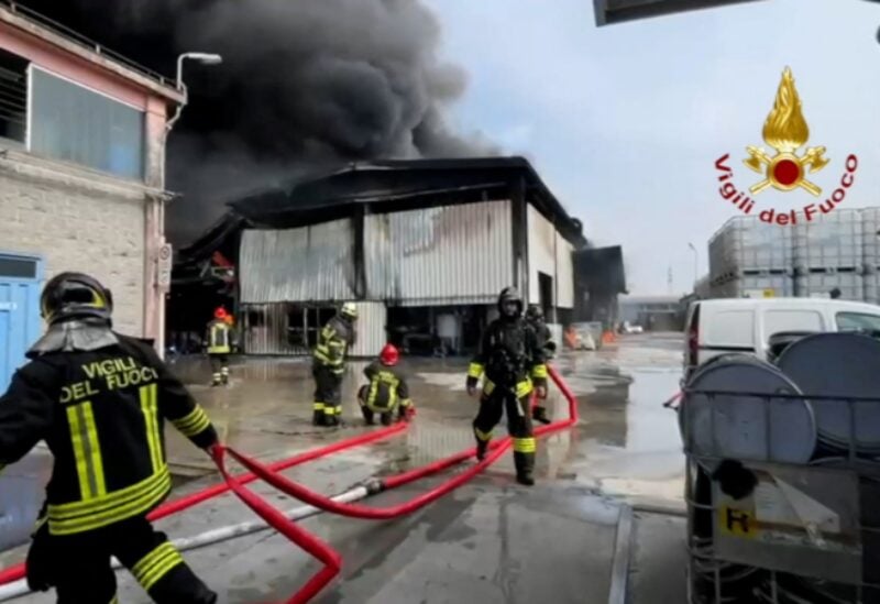 Fire brigade members work to put out a fire at the Nitrolchimica chemical plant in this still image taken from video in San Giuliano Milanese near Milan, Italy, September 7, 2022. Vigili del Fuoco/Handout via REUTERS THIS IMAGE HAS BEEN SUPPLIED BY A THIRD PARTY. DO NOT OBSCURE LOGO.