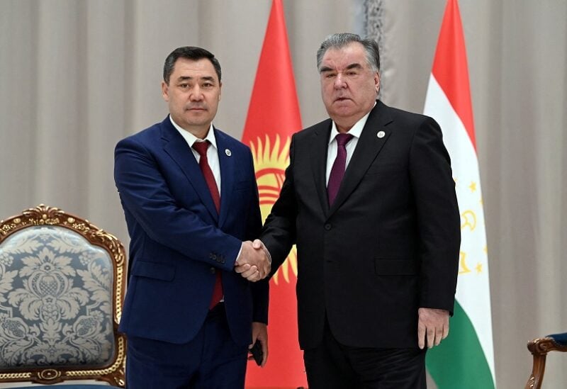 Kyrgyz President Sadyr Japarov shakes hands with Tajik President Emomali Rakhmon during a meeting on the sidelines of the Shanghai Cooperation Organization (SCO) summit in Samarkand, Uzbekistan September 16, 2022. Sultan Dosaliev/Kyrgyz Presidential Press Service/Handout via REUTERS ATTENTION EDITORS - THIS IMAGE WAS PROVIDED BY A THIRD PARTY.