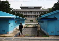 South Korean and U.S. soldiers stand guard in the truce village of Panmunjom inside the demilitarized zone (DMZ) separating the two Koreas, South Korea, July 19, 2022. REUTERS