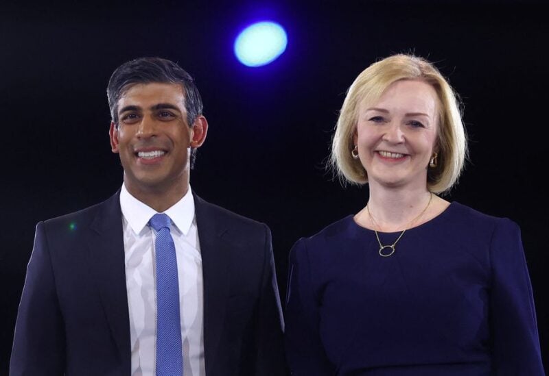 Conservative leadership candidates Liz Truss and Rishi Sunak stand together as they attend a hustings event, part of the Conservative party leadership campaign, in London, Britain August 31, 2022