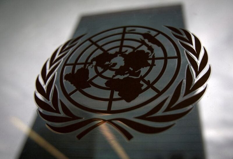 The United Nations headquarters building is pictured though a window with the UN logo in the foreground in the Manhattan borough of New York August 15, 2014. REUTERS