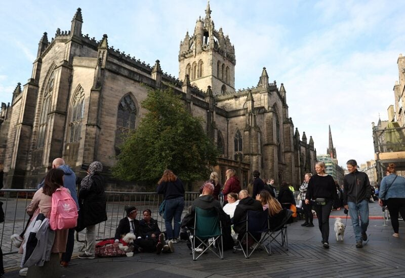 People wait outside St Giles' Cathedral for the procession of the coffin of Britain's Queen Elizabeth, following her death, in Edinburgh, Scotland, Britain September 12, 2022. REUTERS/Carl Recine