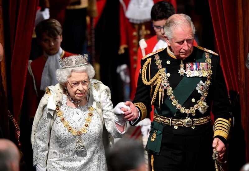 FILE PHOTO: Britain's Queen Elizabeth arrives at the State Opening of Parliament with Charles, Prince of Wales, in London, Britain October 14, 2019. REUTERS/Toby Melville/Pool/File Photo