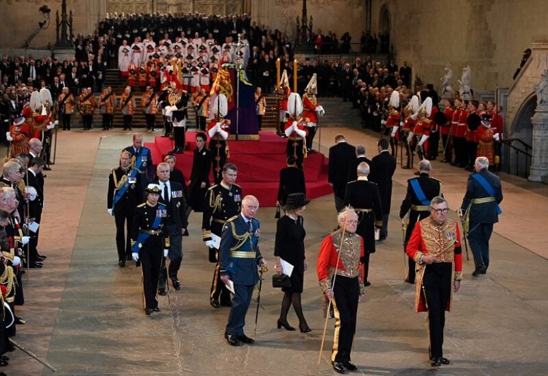 Britain's King Charles III (C) leaves with Britain's Camilla, Queen Consort after a service for the reception of Queen Elizabeth II's coffin at Westminster Hall, in the Palace of Westminster in London on September 14, 2022, where the coffin of Queen Elizabeth II, will Lie in State. OLI SCARFF/Pool via REUTERS