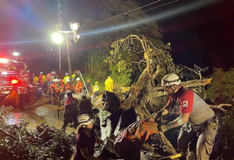 Members of the Red Cross and firefighters work at the scene of a deadly bus accident, where a landslide reportedly hit the vehicle, throwing it off a cliff, in Cambronero, Alajuela Province, Costa Rica in this social media handout image released September 18, 2022. Cruz Roja/Handout via REUTERS NO RESALES. NO ARCHIVES THIS IMAGE HAS BEEN SUPPLIED BY A THIRD PARTY.