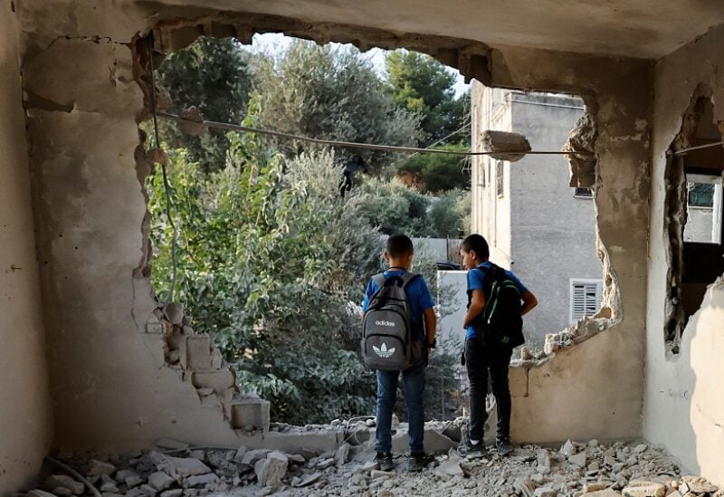 Palestinians inspect the house of Tel Aviv attacker Raed Hazem after it was demolished by Israeli forces in Jenin in the Israeli-occupied West Bank September 6, 2022 REUTERS/Raneen Sawafta