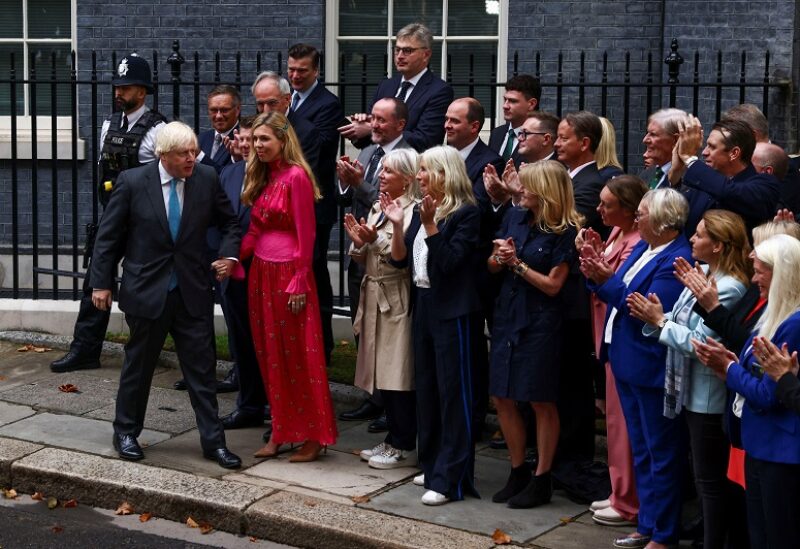 Outgoing British Prime Minister Boris Johnson, with his wife Carrie Johnson, leaves after delivering a speech on his last day in office, outside Downing Street, in London, Britain September 6, 2022. REUTERS/Henry Nicholls