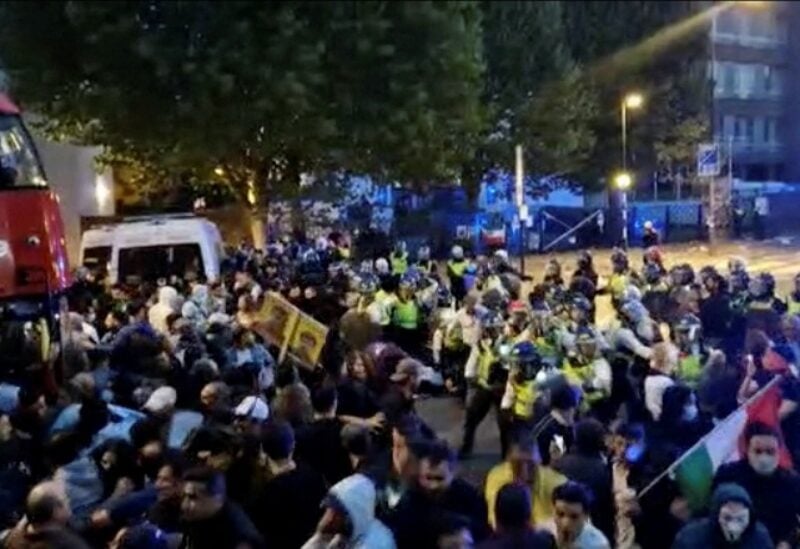 Police confront protesters during demonstrations following the death of Mahsa Amini in Iran, in London, Britain September 25, 2022 in this screen grab obtained from social media video. Obtained By Reuters/via REUTERS THIS IMAGE HAS BEEN SUPPLIED BY A THIRD PARTY. MANDATORY CREDIT. NO RESALES. NO ARCHIVES
