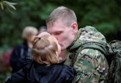 A Russian reservist bids farewell to relatives before his departure for a base in the course of partial mobilization of troops, aimed to support the country's military campaign in Ukraine, in the town of Volzhsky in the Volgograd region, Russia September 28, 2022. REUTERS/Stringer TPX IMAGES OF THE DAY