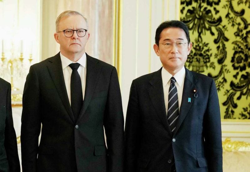 Australian Anthony Albanese, left, poses for a photo with Japanese Prime Minister Fumio Kishida before their meeting at the Akasaka Palace state guest house in Tokyo on Sept. 27, 2022. Hiro Komae/AP