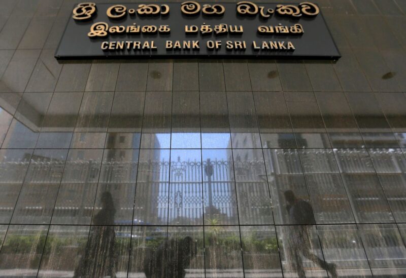 People walk past the main entrance of the Sri Lanka's Central Bank in Colombo, Sri Lanka March 24, 2017. REUTERS/Dinuka Liyanawatte/File Photo