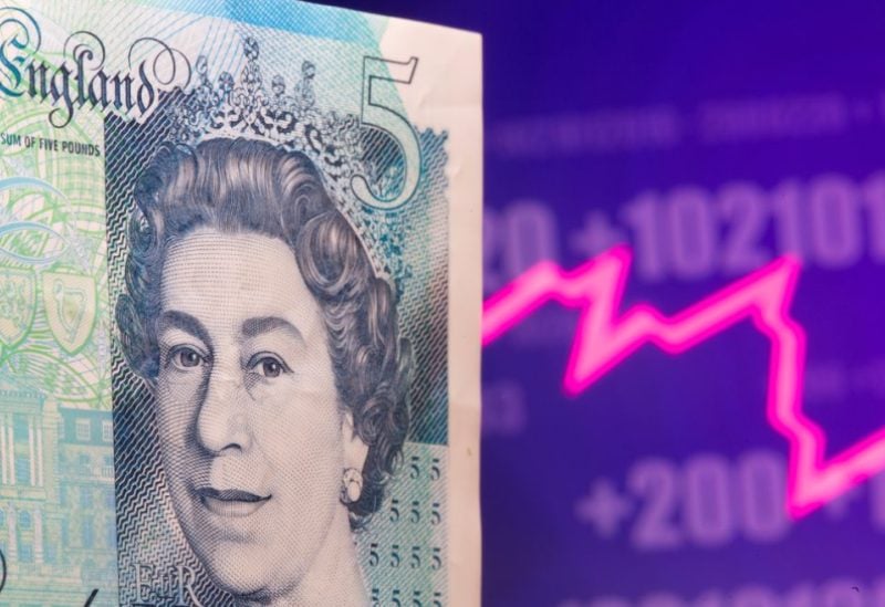 A British Pound banknote is seen in front of displayed stock graph in this illustration taken May 7, 2021. REUTERS/Dado Ruvic/Illustration