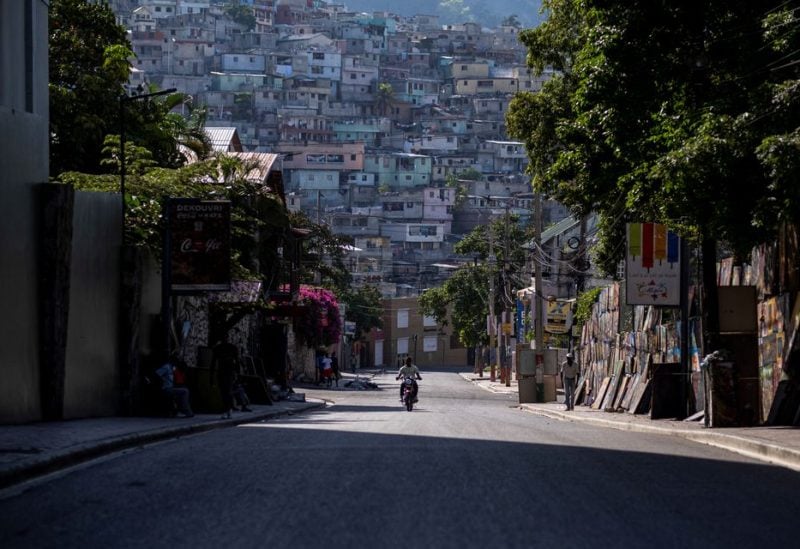 A man rides a motorcycle on a quiet street usually packed with people and heavy traffic in Port-au-Prince, Haiti October 12, 2022. REUTERS/Ricardo Arduengo