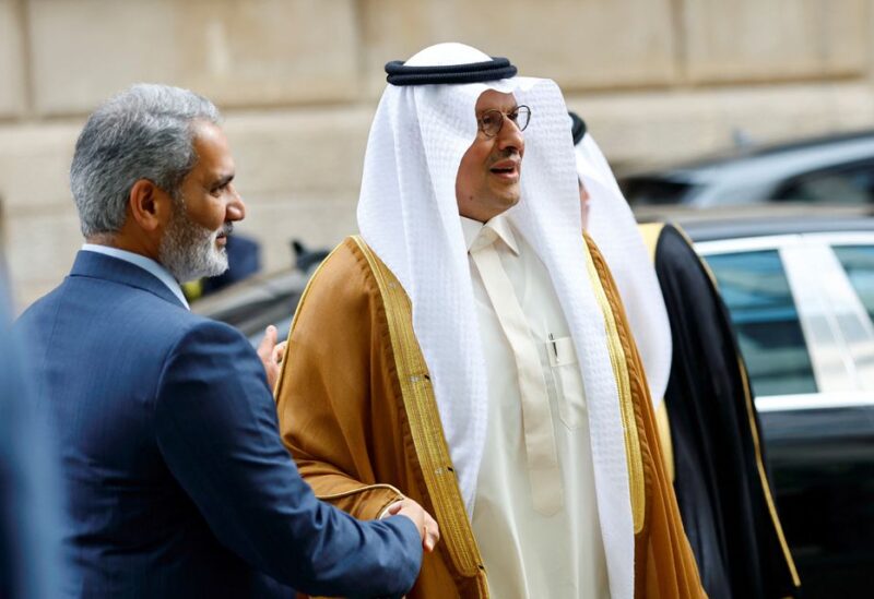 Saudi Arabia's Minister of Energy Prince Abdulaziz bin Salman Al-Saud and OPEC Secretary-General Haitham al-Ghais shake hands at the Organisation of the Petroleum Exporting Countries (OPEC) headquarters in Vienna, Austria October 5, 2022. REUTERS/Lisa Leutner