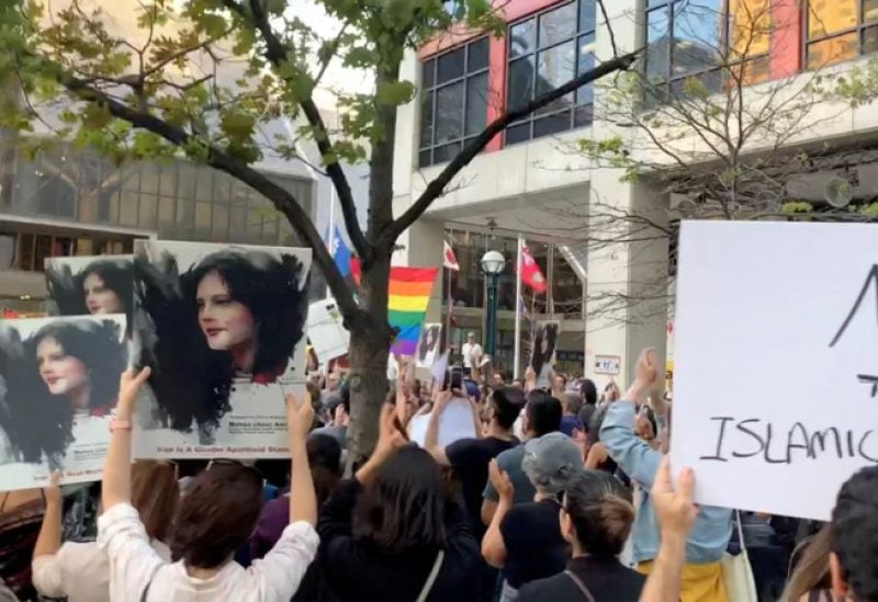 People attend a protest in solidarity with the women in Iran, following the death of Mahsa Amini, in Toronto, Canada, September 19, 2022 in this screen grab obtained from social media video obtained by REUTERS/File Photo