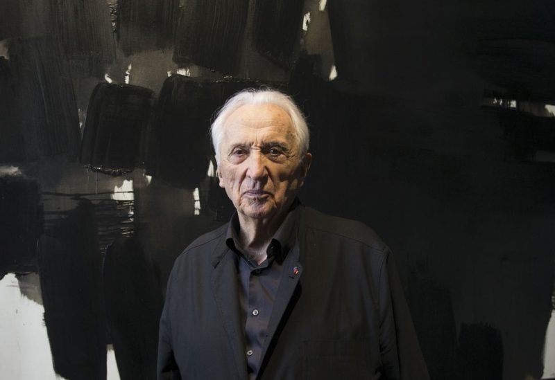 French painter Pierre Soulages poses near one of his paintings (143x202, November 19, 1964) after the inauguration of the Soulages Museum in Rodez, southwestern France, May 30, 2014. REUTERS/Philippe Wojazer