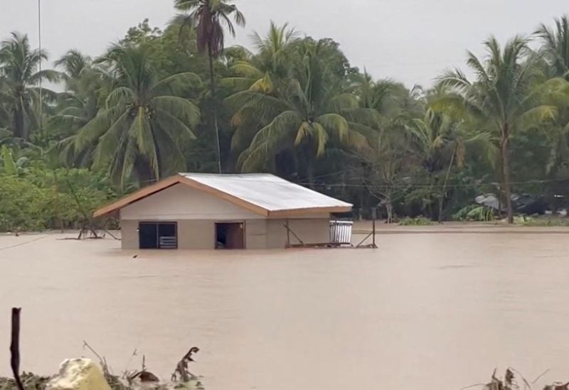 Flood waters surround a building following a heavy storm in Datu Odin Sinsuat, Maguindanao, Philippines October 28, 2022 in this still image obtained from a social media video. Alizain A. Tahir/via REUTERS
