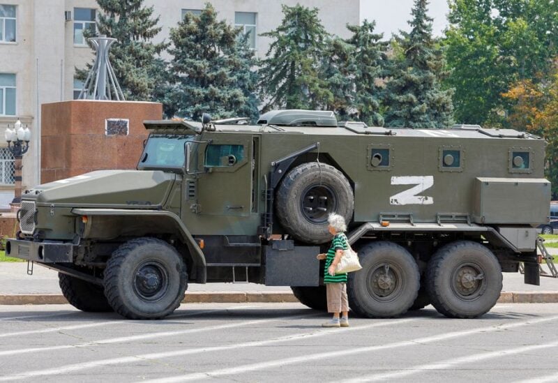 An armoured truck of pro-Russian troops is parked near Ukraine's former regional council's building during Ukraine-Russia conflict in the Russia-controlled city of Kherson, Ukraine July 25, 2022. REUTERS/Alexander Ermochenko