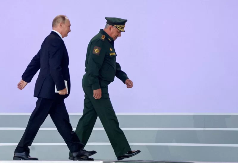 Russian President Vladimir Putin and Defence Minister Sergei Shoigu attend a ceremony opening the international military-technical forum Army-2022 at Patriot Congress and Exhibition Centre in the Moscow region, Russia August 15, 2022. REUTERS