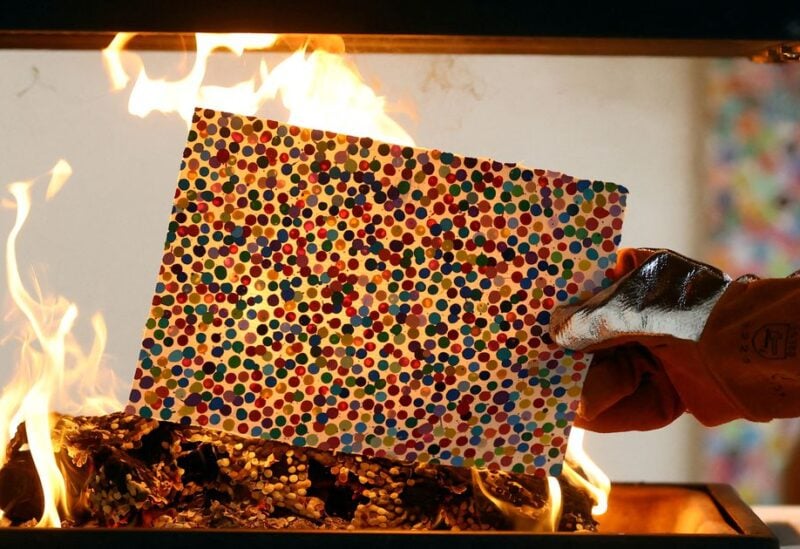British artist Damien Hirst takes part in a burn event which is part of his latest NFT exhibition "The Currency", in London, Britain, October 11, 2022. REUTERS/Hannah McKay