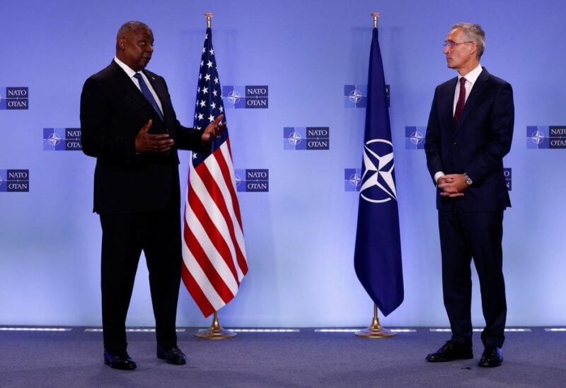 NATO Secretary General Jens Stoltenberg and U.S. Defense Secretary Lloyd Austin deliver short remarks during a NATO defence ministers meeting at the Alliance's headquarters, in Brussels, Belgium October 13, 2022. REUTERS/Yves Herman