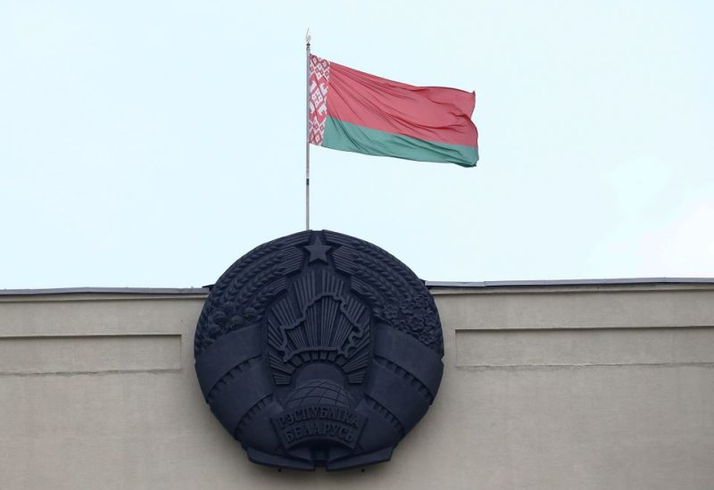 Belarusian state flag and emblem are seen on a building at Independence Square in Minsk, Belarus November 7, 2019. REUTERS/Vasily Fedosenko