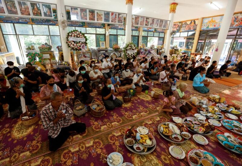 People pray at Wat Rat Samakee temple following a mass shooting in the town of Uthai Sawan, Nong Bua Lam Phu province, Thailand October 8, 2022. REUTERS/Jorge Silva