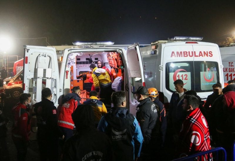Medics and rescuers carry the body of a victim to an ambulance after an explosion at a coal mine, in Amasra in the northern Bartin province, Turkey October 15, 2022. REUTERS
