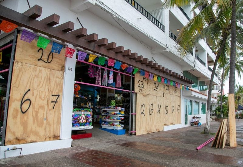 A store covered with wood sheets is pictured as Hurricane Roslyn approaches tourist zones along Mexico's Pacific coast, in Puerto Vallarta in Jalisco state, Mexico. October 22, 2022. REUTERS