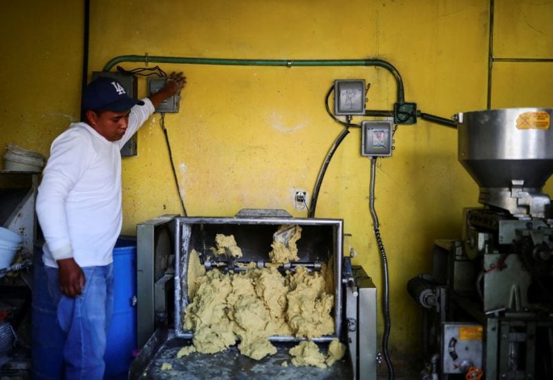 An employee prepares dough to make tortillas at a tortilla stall in Ozumba de Alzate, State of Mexico, Mexico, May 24, 2022. REUTERS/Edgard Garrido