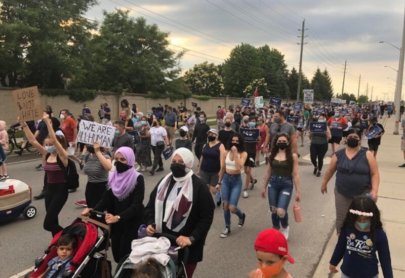 Thousands of people marched in London, Ont., Friday night in a multi-faith show of solidarity for the Afzaal family, four of whom were killed June 6 in a hit and run that police say was motivated by anti-Muslim hate. (Travis Dolyny/CBC News)