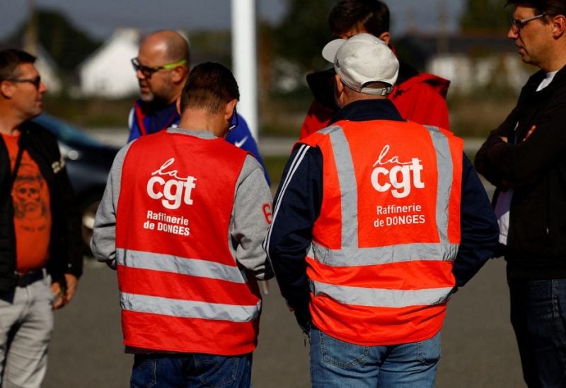 Workers on strike gather in front of the French oil giant TotalEnergies refinery in Donges near Saint-Nazaire, France October 12, 2022. REUTERS/Stephane Mahe/File Photo