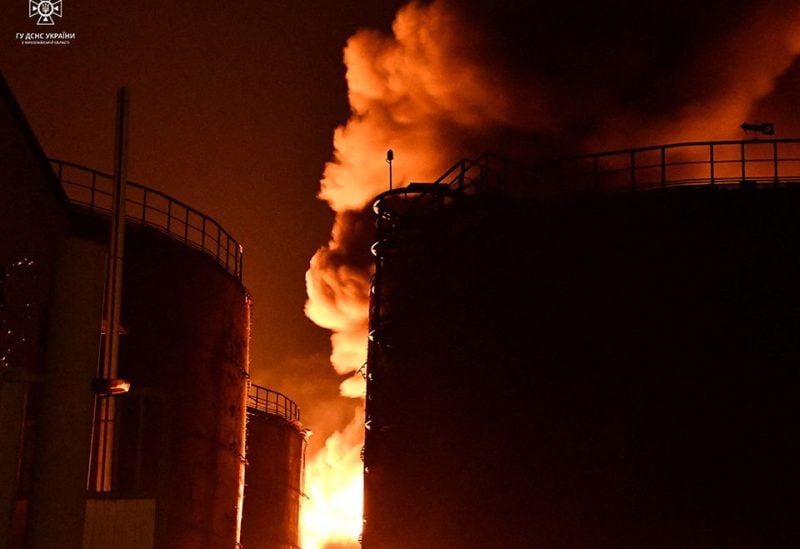 Sunflower oil storage tanks burn after Russian suicide drone strikes, which Ukrainian authorities consider to be Iranian-made unmanned aerial vehicles (UAVs) Shahed-136, amid Russia's attack on Ukraine, in Mykolaiv, Ukraine October 17, 2022. Press service of the State Emergency Service of Ukraine/Handout via REUTERS