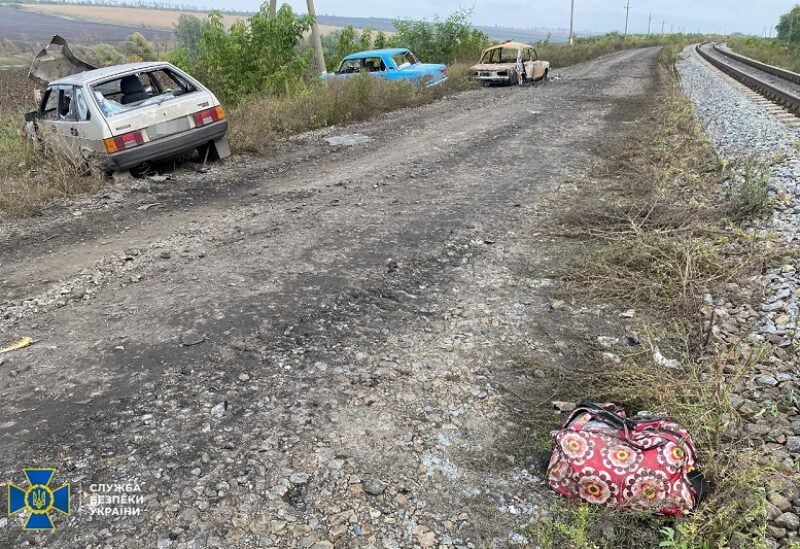 Cars from a civilian convoy, which Ukrainian State Security Service say was hit by a shelling of Russian troops amid Russia's attack on Ukraine, are seen between occupied Svatove town in Luhansk region and Ukrainian-held town of Kupiansk, in location given as Kharkiv region, Ukraine, in this handout picture released October 1, 2022. Press Service of the State Security Service of Ukraine/Handout via REUTERS ATTENTION EDITORS - THIS IMAGE HAS BEEN SUPPLIED BY A THIRD PARTY. DO NOT OBSCURE LOGO.