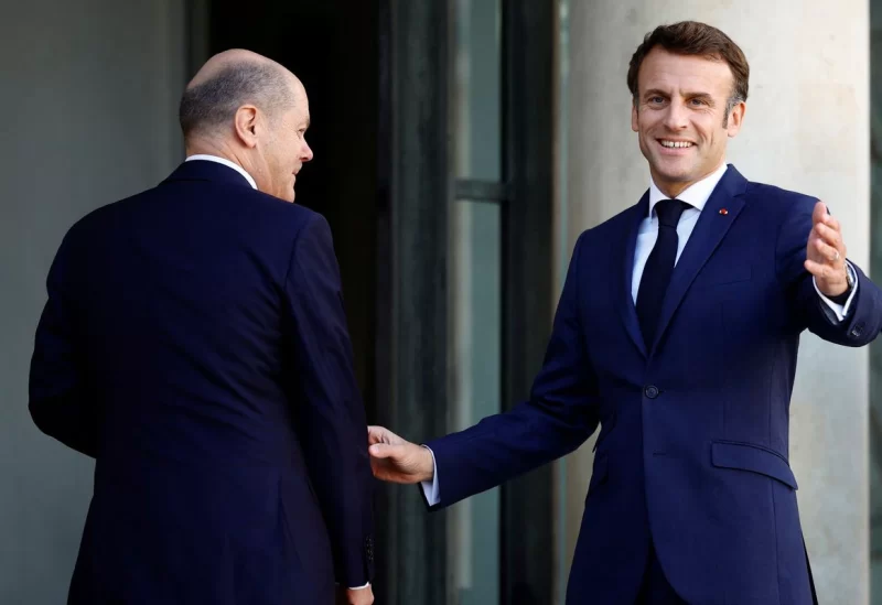 French President Emmanuel Macron welcomes German Chancellor Olaf Scholz before a meeting at the Elysee Palace in Paris, France, October 26, 2022. REUTERS/Sarah Meyssonnier