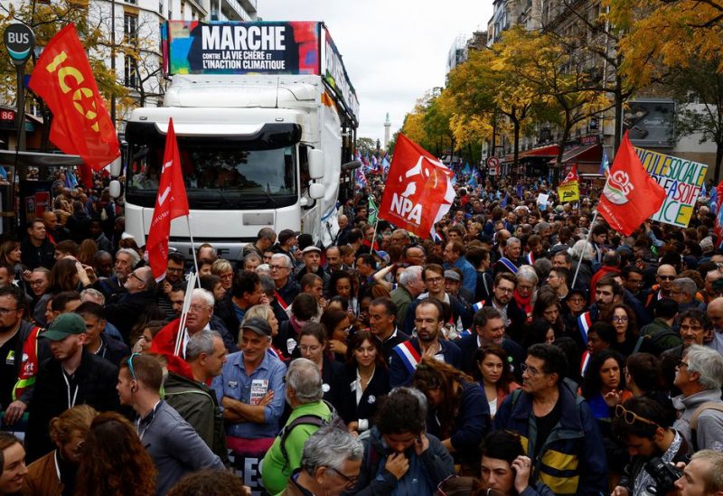 Demonstrators take part in a protest by New Ecologic and Social People's Union (NUPES), a coalition of left and green parties, against soaring inflation, in Paris, France October 16, 2022 - REUTERS
