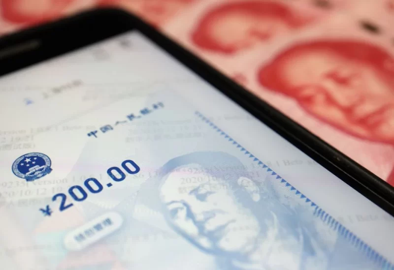 China's official app for digital yuan is seen on a mobile phone next to 100-yuan banknotes in this illustration picture taken October 16, 2020. REUTERS
