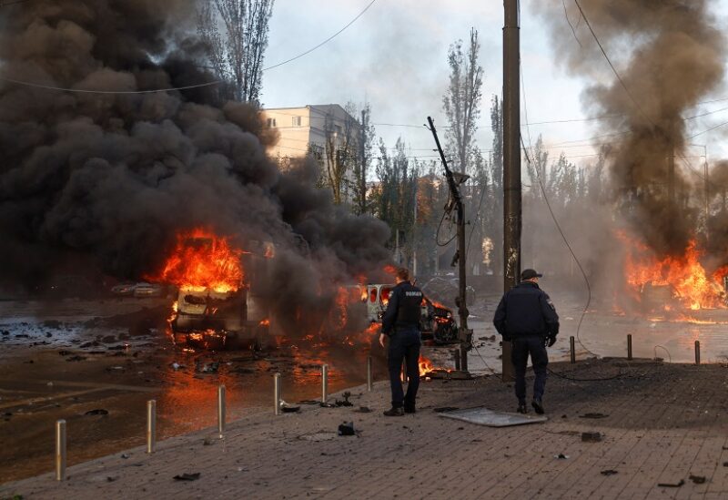 Cars are seen on fire after Russian missile strikes, as Russia's attack continues, in Kyiv, Ukraine October 10, 2022. REUTERS/Valentyn Ogirenko