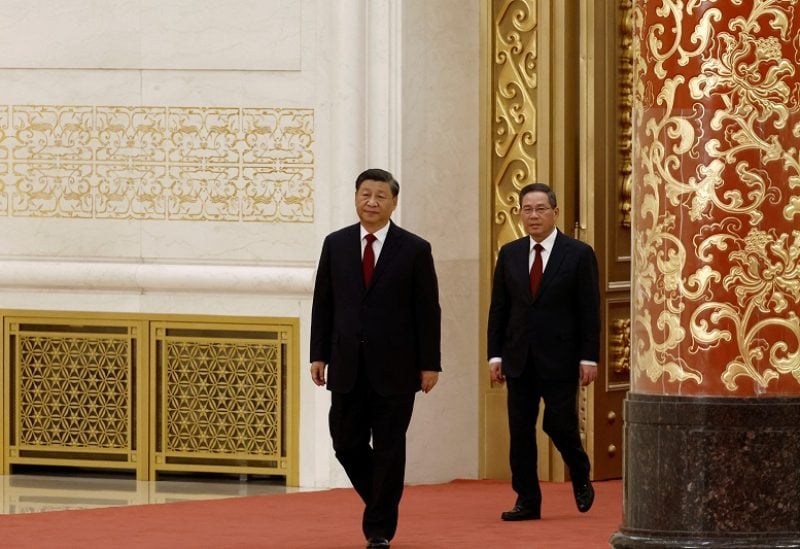 New Politburo Standing Committee members Xi Jinping and Li Qiang arrive to meet the media following the 20th National Congress of the Communist Party of China, at the Great Hall of the People in Beijing, China October 23, 2022. REUTERS/Tingshu Wang