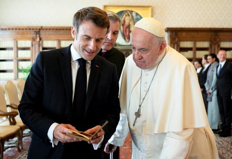 Pope Francis meets French President Emmanuel Macron and his wife Brigitte Macron (not pictured) following a private audience at the Vatican October 24, 2022. Vatican Media/Handout via REUTERS ATTENTION EDITORS - THIS IMAGE HAS BEEN SUPPLIED BY A THIRD PARTY.