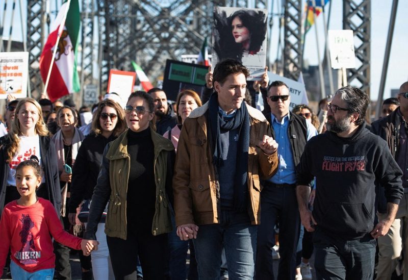 Canada's Prime Minister Justin Trudeau marches along Alexandra Bridge during a protest in support of women in Iran following the death of Mahsa Amini, in Ottawa, Ontario, Canada October 29, 2022. REUTERS/Spencer Colby
