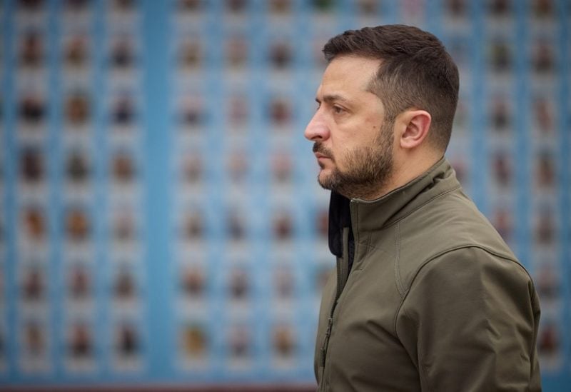 Ukraine's President Volodymyr Zelenskiy visits the Memory Wall of Fallen Defenders of Ukraine, amid Russia's attack on Ukraine, during marking the Defender of Ukraine Day in Kyiv, Ukraine October 14, 2022. Ukrainian Presidential Press Service/Handout via REUTERS ATTENTION EDITORS - THIS IMAGE HAS BEEN SUPPLIED BY A THIRD PARTY.