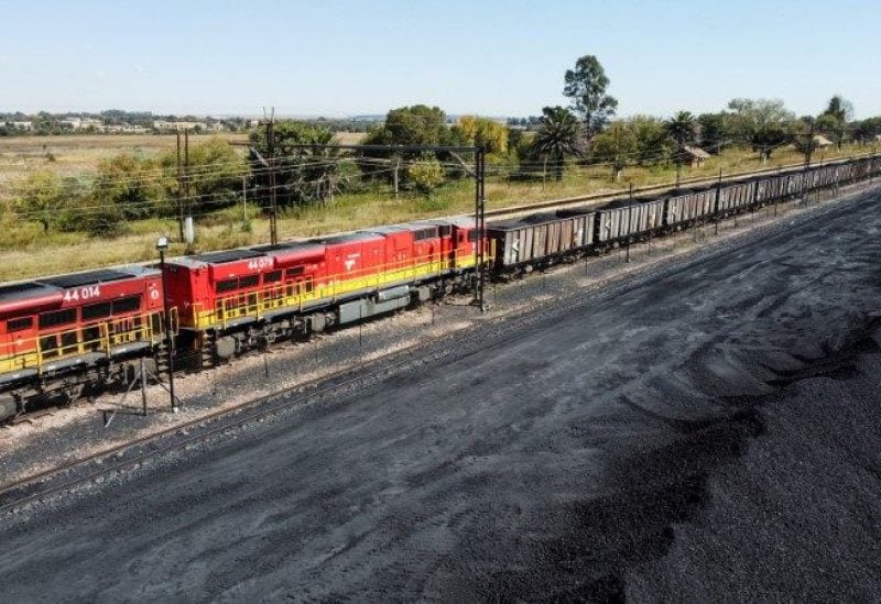 A Transnet Freight Rail train is seen next to tons of coal mined from the nearby Khanye Colliery mine, at the Bronkhorstspruit station, in Bronkhorstspruit, around 90 kilometres north-east of Johannesburg, South Africa. REUTERS/Siphiwe Sibeko