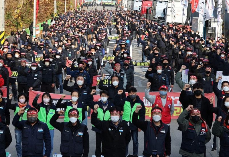 Unionized truckers shout slogans during their rally as they kick off their strike in front of transport hub Uiwang, south of Seoul, South Korea November 24, 2022. Yonhap/via REUTERS