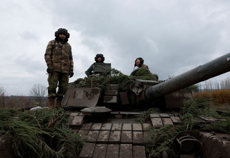 Ukrainian soldiers prepare to fire a round on the frontline from a T80 tank that was captured from Russians during a battle in Trostyanets in March, as Russia's invasion of Ukraine continues, in the eastern Donbas region of Bakhmut, Ukraine, November 4, 2022. REUTERS/Clodagh Kilcoyne