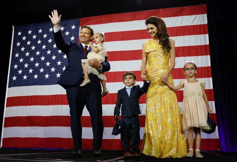 Republican Florida Governor Ron DeSantis waves from stage with his wife Casey and children during his 2022 U.S. midterm elections night party in Tampa, Florida, U.S., November 8, 2022. REUTERS/Marco Bello