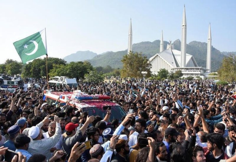 Men gather around an ambulance as they attend a funeral of journalist Arshad Sharif, who was killed in a police shooting in Kenya, at Faisal mosque in Islamabad, Pakistan October 27, 2022. REUTERS/Waseem Khan