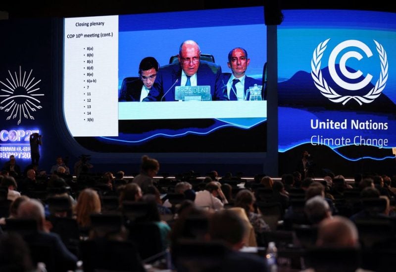 A screen shows COP27 President Sameh Shoukry delivering a statement during the closing plenary at the COP27 climate summit in Red Sea resort of Sharm el-Sheikh, Egypt, November 20, 2022. REUTERS/Mohamed Abd El Ghany