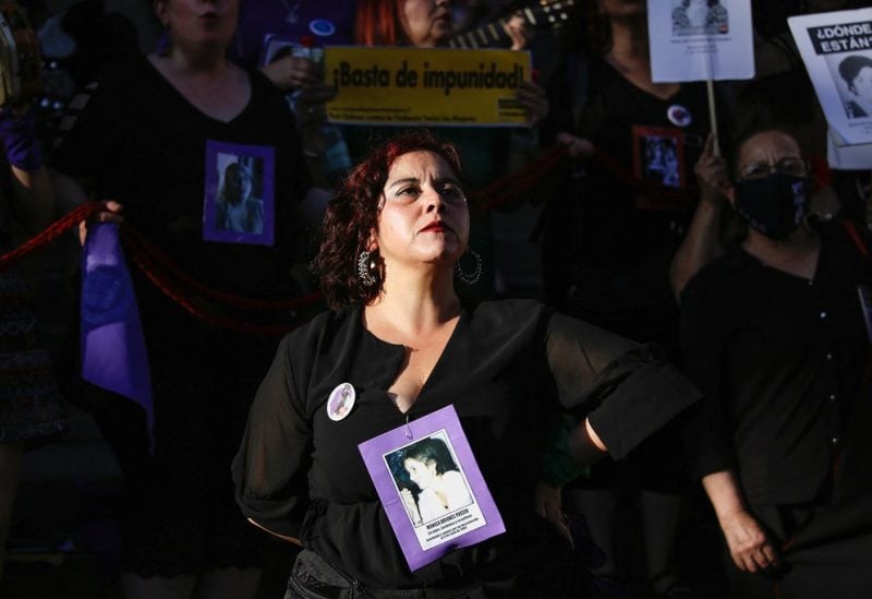 A person takes part in a protest to mark the International Day for the Elimination of Violence against Women, in Santiago, Chile, November 25, 2022. REUTERS/Sofia Yanjari/File Photo
